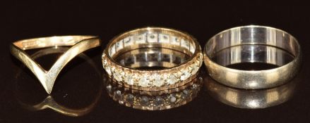 A 9ct gold eternity ring (2.4g, size M), a 9ct gold wedding band (1.5g, size Q) and a 9ct gold 'V'
