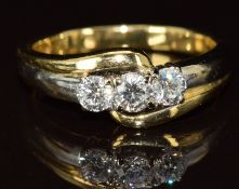 An 18ct gold ring set with three diamonds, each approximately 0.16ct, 5.5g, size O/P