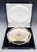 Elizabeth II Garrard & Co. cased hallmarked silver salver raised on ball and claw feet, London 1992,