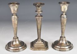 Three hallmarked silver candlesticks comprising a pair, Birmingham 1917, maker William Hutton & Sons
