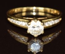 An 18ct gold ring set with cubic zirconia, 2.6g, size L