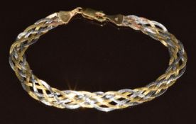 A 9ct gold bi-coloured bracelet made up of plaited ribbon chain, 2.8g, 17.5cm