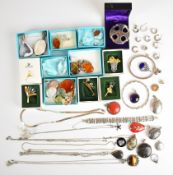 A collection of silver jewellery including twenty-two pendants including coral, amethyst, rose