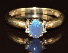 A 9ct gold ring set with an Andamooka semi black opal and topaz, size K, 1.9g