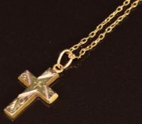 A 14k gold cross (1.8g, 2cm) on a yellow metal chain (2.5g, 48cm)
