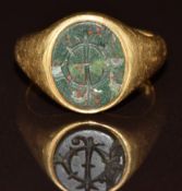An 18ct gold signet ring set with a bloodstone intaglio seal, London 1919, 9.1g, size N