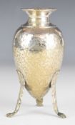 Greek or similar silver vase with gadrooned edge, hammered decoration and raised on three lion paw
