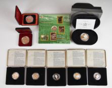 Ten Canadian silver coins comprising five sporting 1998 50 cent coins, 1996 Moose 50 cent coin, 1974