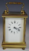Brass carriage clock with bevelled glass panels, marked to the movement made in England, H12cm