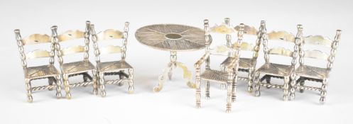 Seven Dutch novelty silver chairs and table, each with Dutch silver marks, height of tallest chair