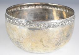 Burmese, Thai or similar silver bowl with embossed decorative rim, signed to base, diameter 15cm,