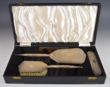 Hallmarked silver dressing table set, hand mirror and two brushes, hallmarked for Birmingham 1939/