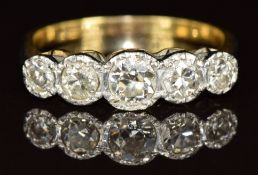 An 18ct gold ring set with five diamonds, the largest approximately 0.25ct, 2.2g, size K