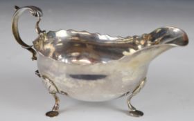 Newcastle Georgian provincial hallmarked silver sauce boat with shaped edge and scroll handle,
