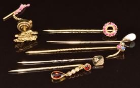 Five 9ct gold stick pins, one set with seed pearls and garnets, one with diamond, one synthetic