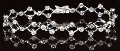 An 18ct white gold bracelet set with forty-two cubic zirconia, 11.6g, 18.5cm