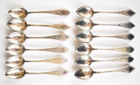 Set of 12 Norwegian J.A. Moller 830 grade silver teaspoons with engraved decoration, length 14cm,