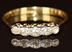 An 18ct gold ring set with five diamonds in a platinum setting, 2g, size P/Q