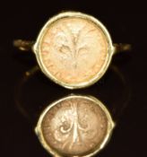 An 18k gold ring set with a gold coin, 1.6g, size H