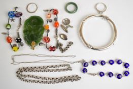 A collection of jewellery including carved jadeite pendant with yellow metal loop, jadeite ring,