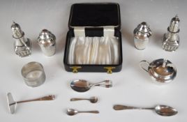 Hallmarked silver items comprising pair of Victorian peppers, Elizabeth II three piece cruet set,