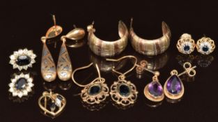 Six pairs of 9ct gold earrings including three pairs set with sapphires, one amethyst, and two bi-