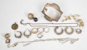 A collection of jewellery including white metal bracelet, four pairs of silver earrings, silver