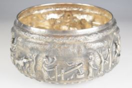 Burmese, Indian or similar silver bowl with embossed border of silver figures and animals, marked to