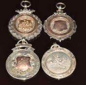 Four 1920/30's silver football medallions, three with applied gold decoration, 48g