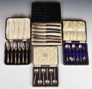 Four cased sets of hallmarked silver and silver handled cutlery comprising cake forks, coffee