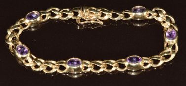 A 9ct gold bracelet set with six oval cut amethysts, 12.7g, 18cm