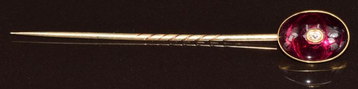 Victorian stick pin set with a foiled garnet and a further old cut diamond