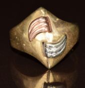 A 9ct gold tri-coloured ring with raised wave design, 3.8g, size N
