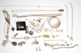A collection of silver jewellery including bangle, rope twist necklace, watch, pendants, chains,