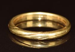 A yellow metal puzzle ring, tests as 18k gold, 3.2g, size M