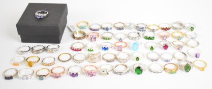 Fifty seven silver rings including ruby, cubic zirconia, amethyst, tanzanite, garnet and opal, 161g