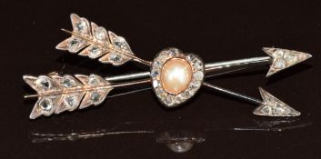 Victorian brooch in the form of two arrows and a heart, set with rose cut diamonds and a natural