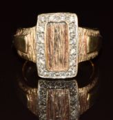 A 9ct gold ring set with diamonds and with textured decoration, 8.8g, size P