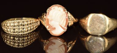 Three 9ct gold rings, one set with a cameo, 5.4g, size M, K & L