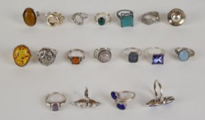 Eighteen silver rings including pressed amber, tiger's eye, amethyst, agate, etc