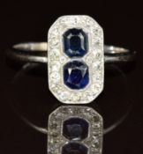 Art Deco 18ct white gold ring set with two sapphires surrounded by diamonds, 3.4g, size Q