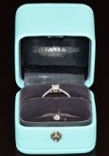 Tiffany & Co ring set with a 0.32ct modified brilliant cut diamond and further diamonds to the band,