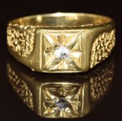 An 18ct gold ring set with cubic zirconia with textured shoulders, 8.4g, size W