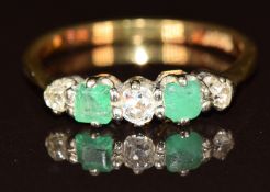 An 18ct gold ring set with two old cut diamonds and two emerald cut emeralds, 3.3g, size P