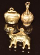 Three 18k gold charms / pendant in the form of a camel, bell and vase, 7.2g
