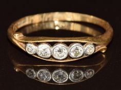 An 18ct gold ring set with five diamonds in a platinum setting, 2.1g, size P