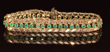 A yellow metal bracelet set with chrysoprase and marquise shaped links, 12.8g, 18.5cm