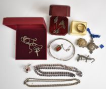 A collection of silver jewellery including bangle, cross and chain, curb link necklace, signet ring,