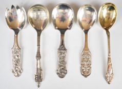 Five Norwegian 830 grade silver serving spoons one with figural handle and named Olav to stem,