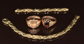 A 9ct gold signet ring (size S), 9ct gold ring set with a garnet (band cut) and a 9ct gold